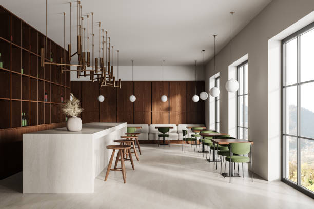 istock Stylish restaurant interior with bar island and dining table with chairs, window 2075513457