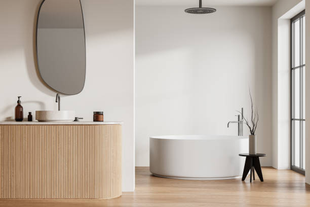 istock Modern hotel bathroom interior with sink, tub and panoramic window 2075513987