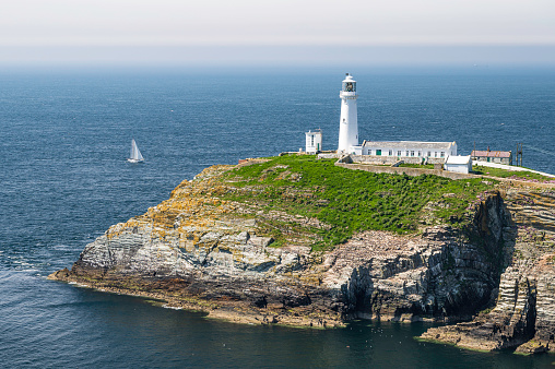 South Stack lighthouse, on Anglesey, north Wales. The lighthouse is located on a small island just off the mainland and is reached by a flight of very steep stairs. It is a bright summers day