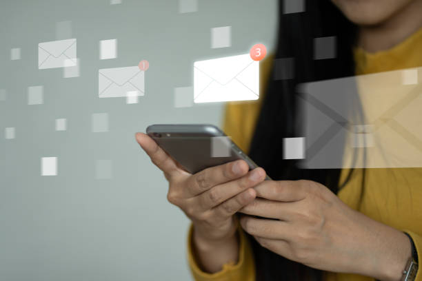 istock email marketing concept, person reading e-mail on smartphone, 2075523172