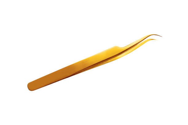 golden tweezers isolated on white