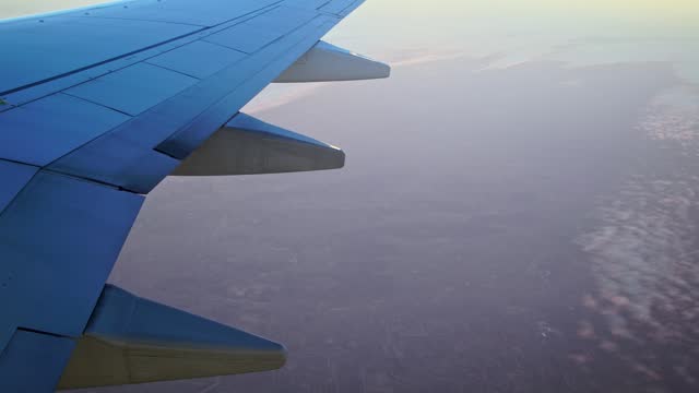 View From An Airplane Window During The Flight With Plane Wing Visible