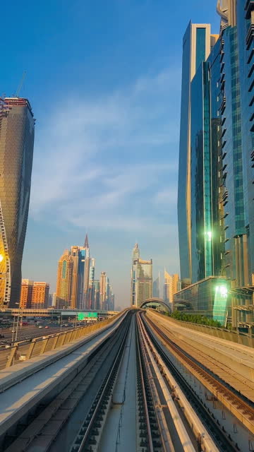 POV Riding Dubai Metro With View of Skyscrapers