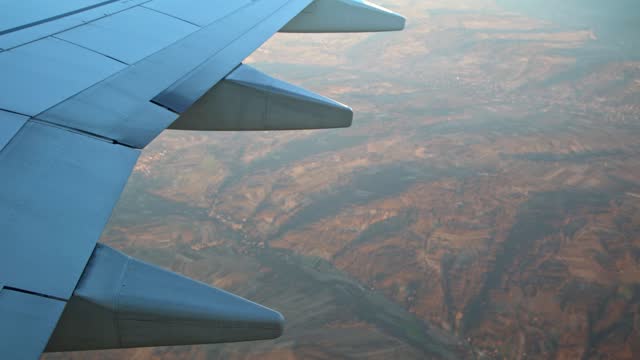 View From An Airplane Window During The Flight With Plane Wing Visible