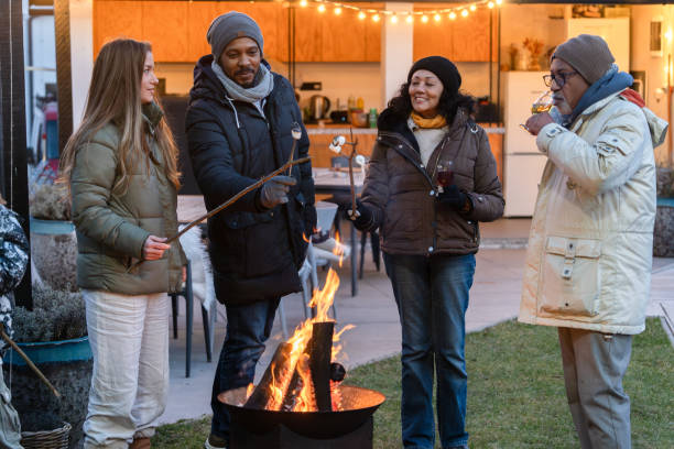 istock A happy family around a fire making marchmellows 2075566397