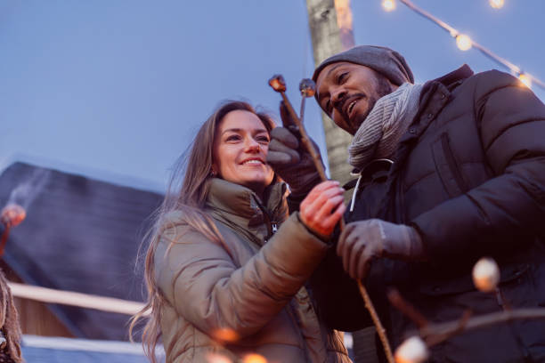 istock Couple enjoying a fire in winter 2075567431