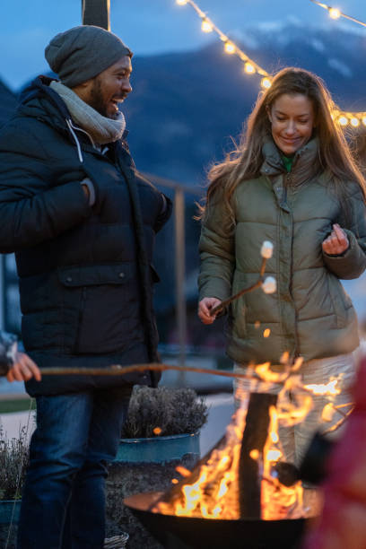 istock Couple enjoying a fire in winter 2075569570