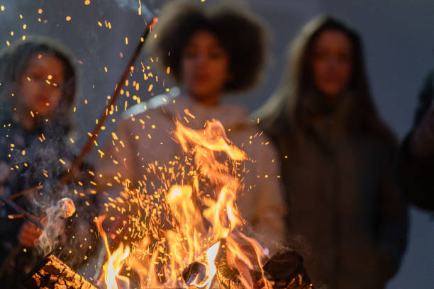 istock A happy family around a fire making marchmellows 2075571157