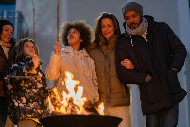 istock A happy family around a fire making marchmellows 2075571158