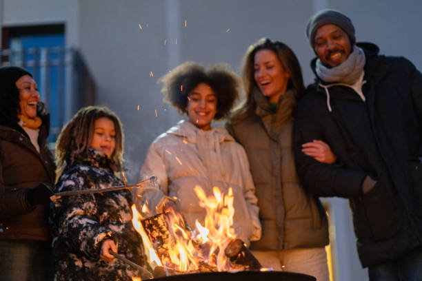 istock A happy family around a fire making marchmellows 2075571160