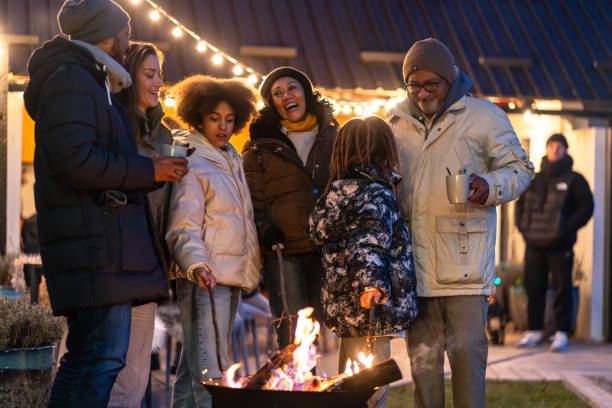 istock A happy family around a fire making marchmellows 2075571707