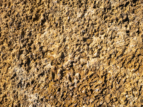 Copper mineralised rock pile, rubble tailings, close with shallow depth of field.