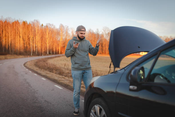 istock Stranded man on the road calling for help 2075664750