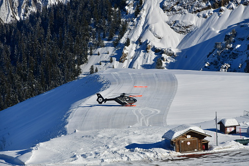 Helicopter on Courchevel airport by winter