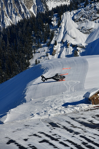 Helicopter on Courchevel airport by winter