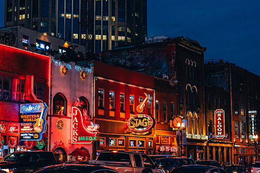 Glowing lights on a busy night at the bars and honky-tonks in the country music center, Broadway Street, in Downtown Nashville, Tennessee