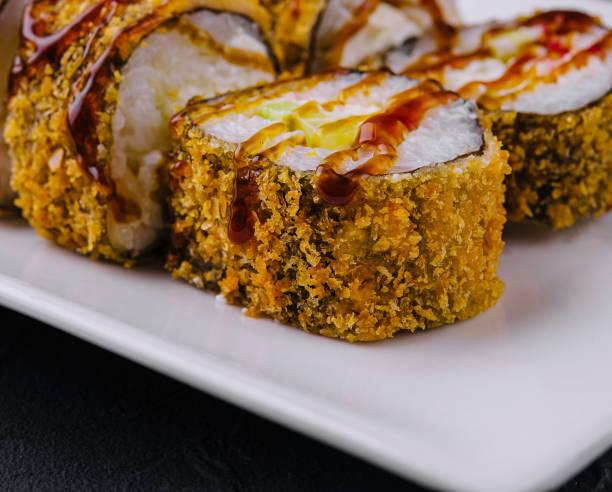 istock Tempura Maki Sushi on white plate 2075741232