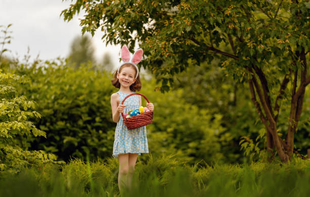 istock child with painting eggs outdoors 2075741295