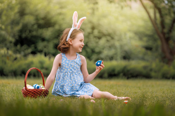 istock child with painting eggs outdoors 2075741305