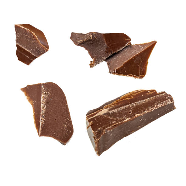 istock Flying Dark chocolate pieces isolated on white background. Broken chocolate chunks  Top view. Flat lay 2075741357