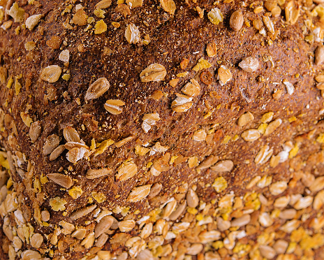 Loaf of fresh baked multigrain bread close up