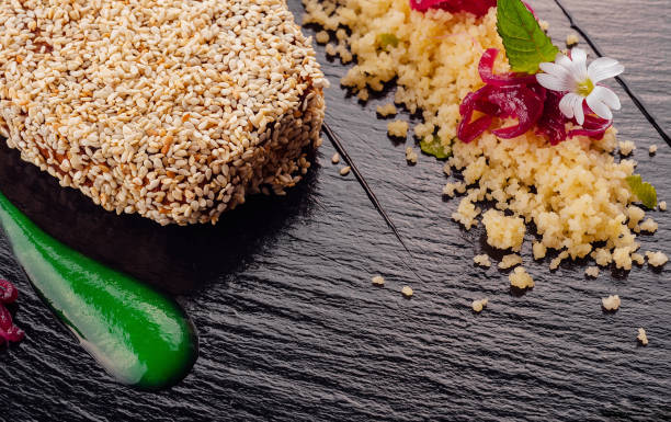 Grilled tuna steak in sesame seeds