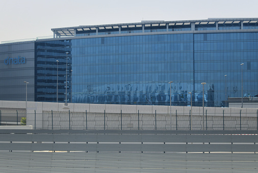 Al Garhoud district, Dubai: modern headquarters of the Emirates Group, next to Dubai International Airport (connected by a tunnel). The Emirates Group is an international aviation holding company, controlled by the Investment Corporation of Dubai, the Sovereign wealth fund and principal investment arm of the Government of Dubai. The Emirates Group comprises Dnata (Dubai National Air Travel Agency), founded in 1959, an aviation services company providing ground handling services at over 100 airports, and Emirates Airline (EK), founded in 1985, the largest airline in the Middle East.