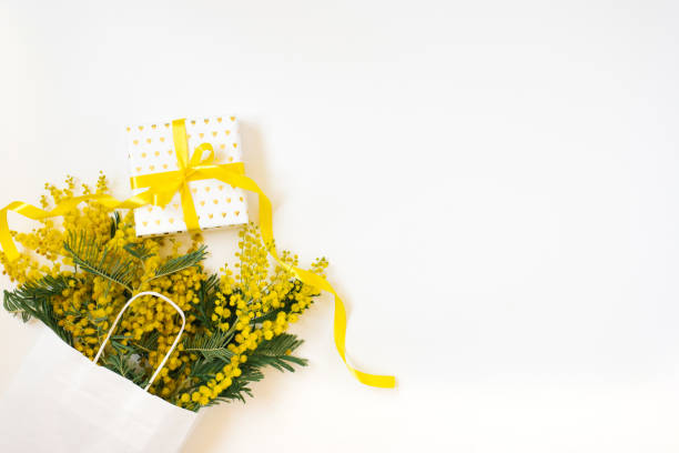 istock Yellow mimosa flowers frame with gift box. Womans day, easter , spring composition. Top view with copy space 2075750248