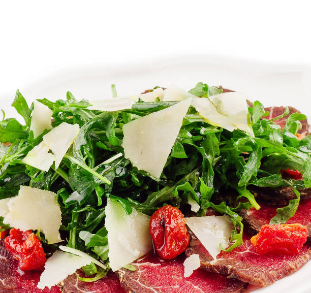 Beef Carpaccio with parmesan, Lemon oil and arugula rock Salad in seaside al fresco restaurant