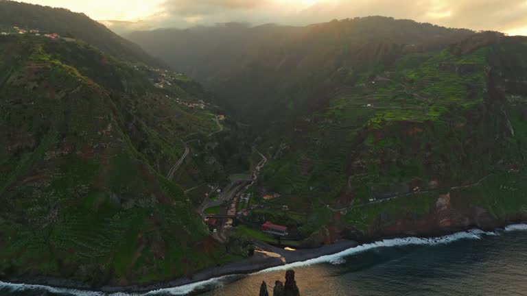 Aerial view big rock in the sea at sunset, Miradouro da Ribeira da Janela. Madeira island, Portugal, Atlantic ocean