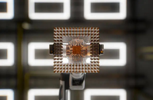 Photo of A robotic arm installing CPU in a computer