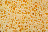 Close up pf texture of yellow sponge, object background concept
