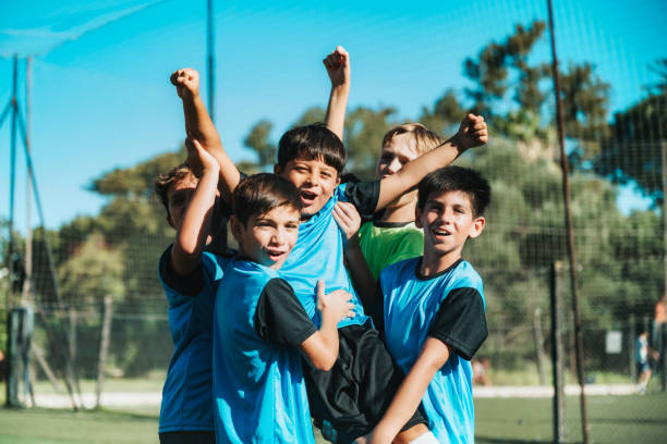 istock five soccer boys cheering after scoring a goal 2075818811