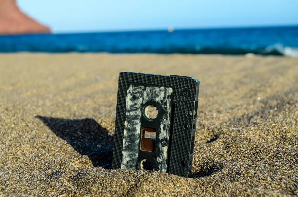 Ancient Retro Musicassette on the Sand near the Water