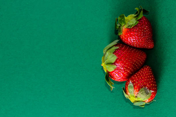 Fresh Ripe Strawberry Fruit on a Colored Background