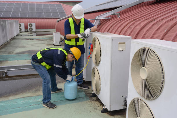 istock An engineer is inspecting the air conditioner, measuring equipment, and adding refrigerant to the air conditioner. 2075823169