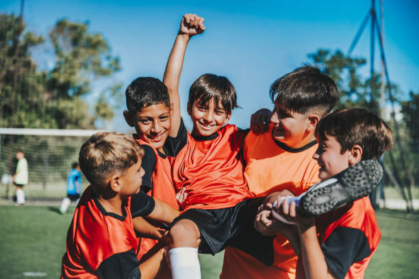 istock five soccer boys cheering after scoring a goal 2075826846