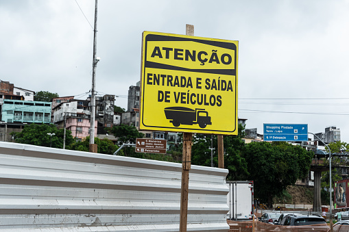 Salvador, Bahia, Brazil - January 25, 2024: Traffic sign informing that it is an entry and exit point for vehicles. City of Salvador, Bahia.
