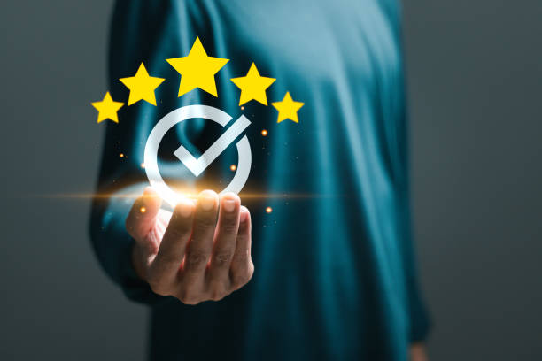 istock ISO service concept. Businessman holding virtual sign of top service Quality assurance with five stars for guarantee product and ISO certification. 2075877458