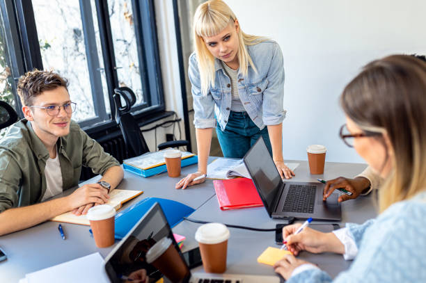 istock Diverse group of young people working on new project together in office. 2075878496