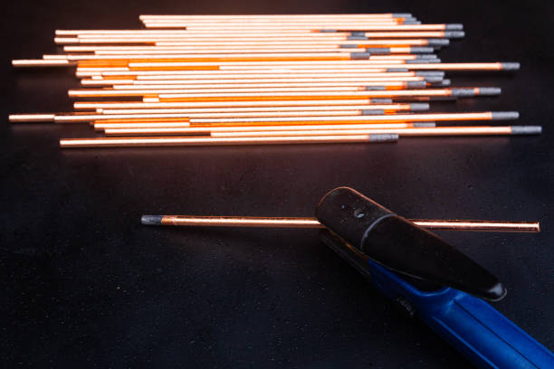 Gouging electrodes with electric holder on a black background.