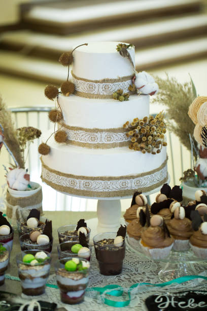 istock Wedding cake with cupcakes at the exhibition 2075899558