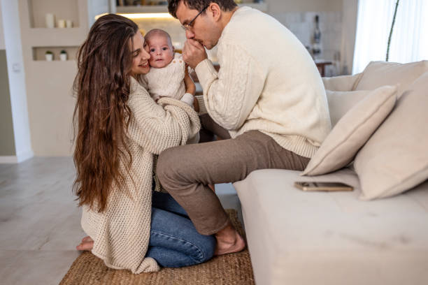 istock Happy young family at home 2075901633