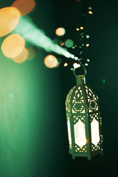 istock Ramadan decoration illuminated arabic lantern against blue background 2075915579