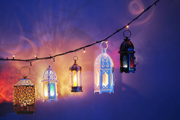 istock Ramadan decoration illuminated arabic lantern against blue background 2075917152