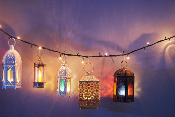 istock Ramadan decoration illuminated arabic lantern against blue background 2075917155