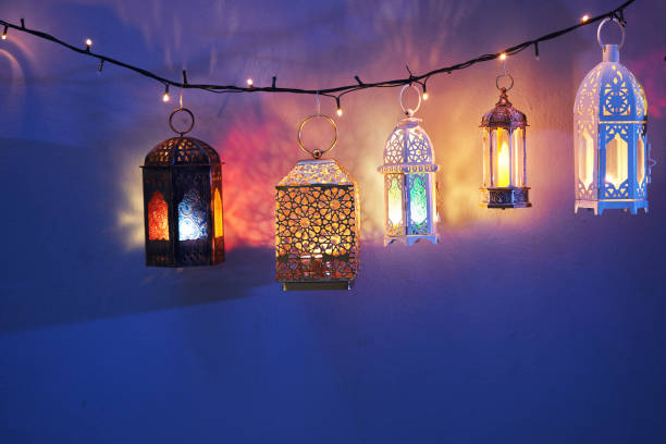 istock Ramadan decoration illuminated arabic lantern against blue background 2075917678