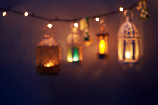 defocussed illuminated arabic lantern as background