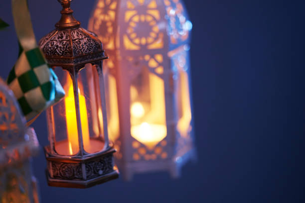 istock ribbon ketupat Arabic lantern on green and blue background 2075918742