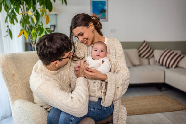 istock Happy young family at home 2075921429